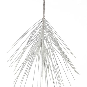 May include: A single pine branch with a frosted, snowy look. The branch is brown and has many thin, green needles.