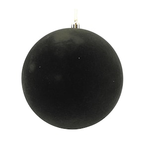 May include: A single, solid black Christmas ornament. The ornament is spherical with a matte finish and a small gold-colored metal cap and loop for hanging. The background is plain white.