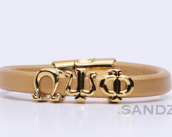Omega Psi Phi-armband: 14kt vergulde letters op Spaans leer