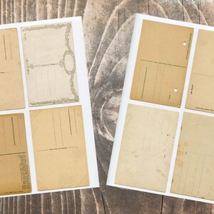 May include: Eight blank vintage postcards with white borders and a light brown paper texture. The postcards have lines for writing addresses and messages.