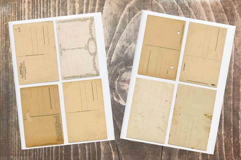 May include: Eight blank vintage postcards with white borders and a light brown paper texture. The postcards have lines for writing addresses and messages.