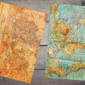 Peut inclure: Deux cartes du monde vintage, l'une avec une palette de couleurs brunes et jaunes et l'autre avec une palette de couleurs bleues et vertes. Les deux cartes sont pli&eacute;es et ont un aspect us&eacute; et vieilli.
