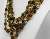 Signed Miriam Haskell Triple Strand Crystal Glass and Faux Pearl Beaded Necklace with Brass Filagree Beads Circa 1950