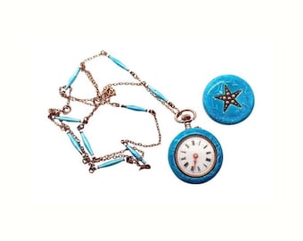 May include: A vintage pocket watch with a turquoise blue enamel case and a matching fob. The watch has a white face with black numerals and hands. A gold-tone chain with turquoise blue enamel accents is also included.