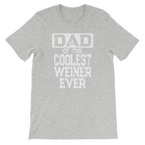 May include: Gray t-shirt with white text that reads "DAD of the COOLEST WEINER EVER".