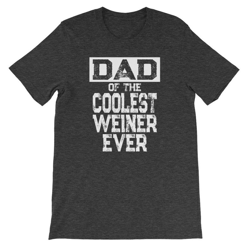 May include: Dark heather grey t-shirt with white text that reads "DAD of the COOLEST WEINER EVER".