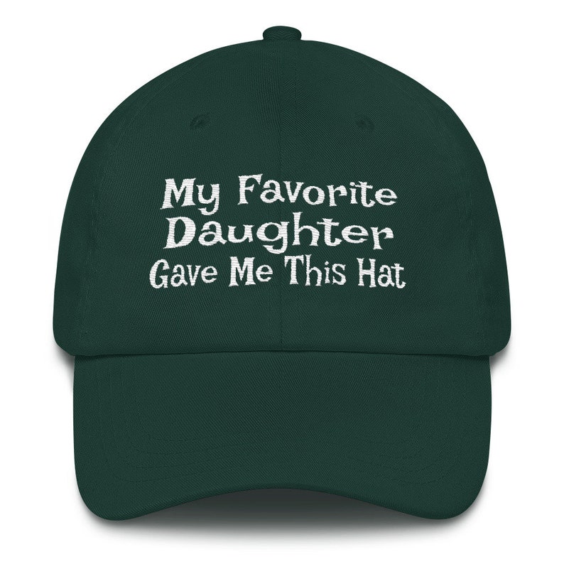 May include: A dark green baseball cap with white embroidered text that reads "My Favourite Daughter Gave Me This Hat".