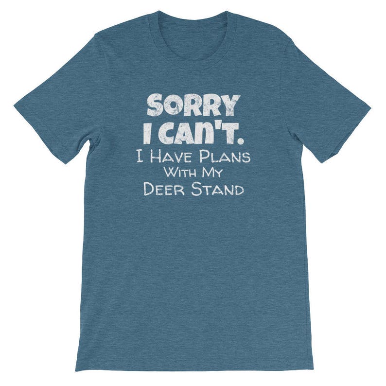 May include: A blue t-shirt with the text "Sorry I can't. I have plans with my deer stand" in white.