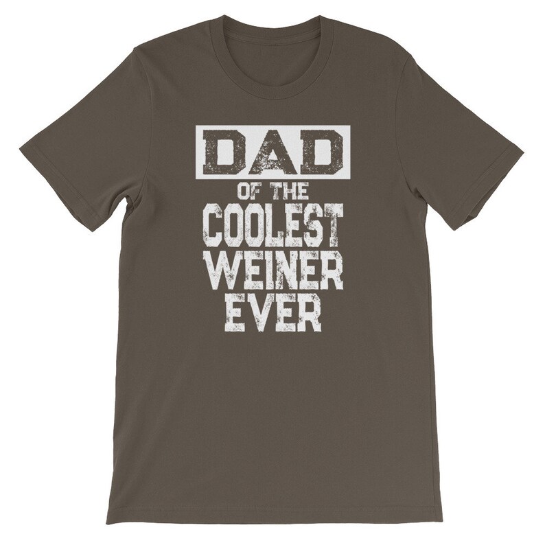 May include: A dark brown t-shirt with white text that reads "DAD OF THE COOLEST WEINER EVER".