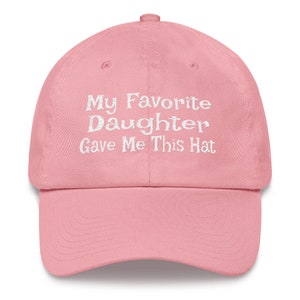 May include: Pink baseball cap with white embroidered text that reads "My Favourite Daughter Gave Me This Hat"
