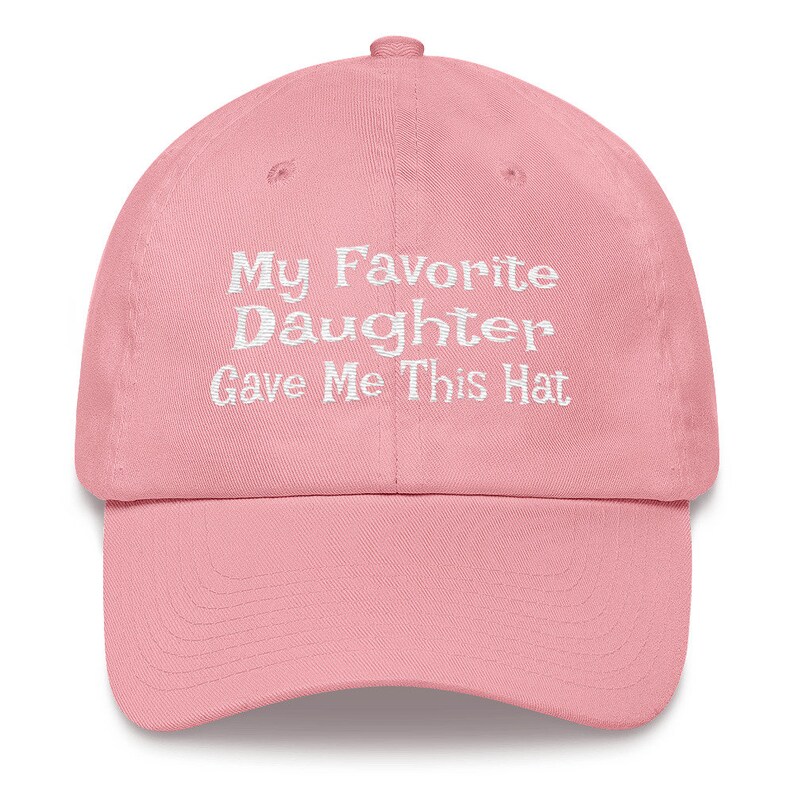 May include: Pink baseball cap with white embroidered text that reads "My Favourite Daughter Gave Me This Hat"