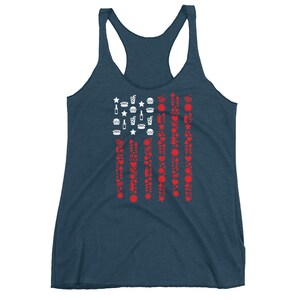 May include: A navy blue tank top with a white and red graphic design resembling the American flag. The flag design is composed of various icons, including stars, burgers, fireworks, and hearts. The tank top has a racerback style.