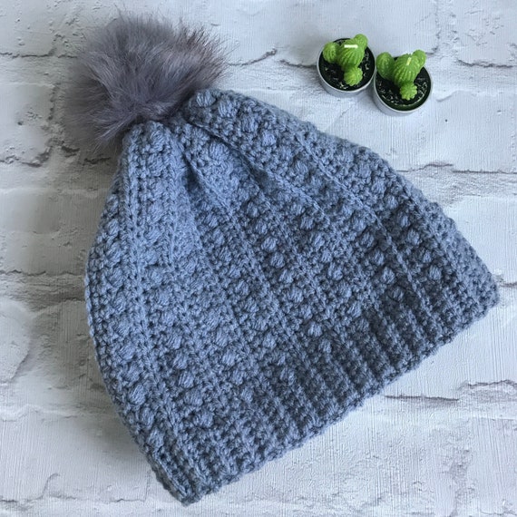 pale blue bobble hat
