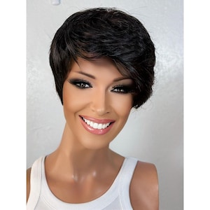 May include: A short, black wig with a side part and choppy layers. The wig is styled with a messy, textured look.
