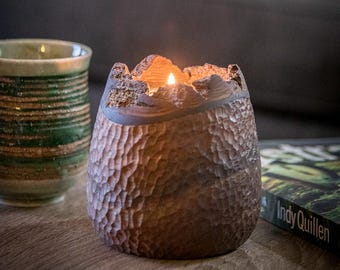 A very unique tealight holder made of solid walnut with the bark.