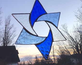 Star in blue and clear textured glass, handcrafted stained glass suncatcher.