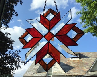 Geometric design, handcrafted stained glass suncatcher.