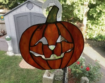 Jack o Lantern handcrafted stained glass suncatcher.