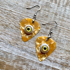 Eyeball Guitar Pick Earrings Gold Eye Guitar Earrings Oddity Weird Gothabilly Gag Gift Psychobilly Clip On Earrings Ear Weights Ear Hangers