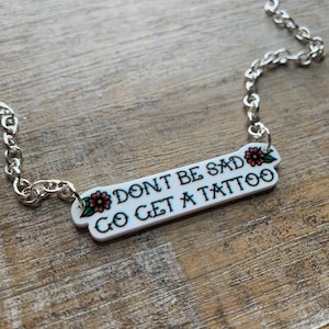Don’t Be Sad Get A Tattoo Necklace Old Fashion Tattoo Necklace Pinup Tattoos Don’t Be Sad Go Get A Tattoo Necklace Tattoo Jewelry
