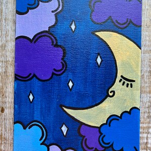 May include: A painting of a crescent moon with a sleeping face, surrounded by purple, blue, and light blue clouds. The background is a dark blue with white diamond-shaped stars.