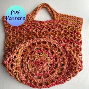 May include: A crocheted market bag with a round bottom and a handle. The bag is made with a multi-colored yarn in shades of red, orange, and yellow.