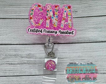 May include: Pink glitter badge reel with the text "CNA Certified Nursing Assistant" and a pink glitter charm.