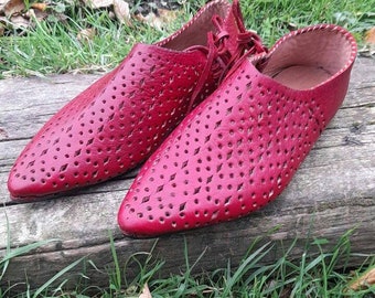 Low medieval shoes with side laces, chiseled decoration 14th/15th century