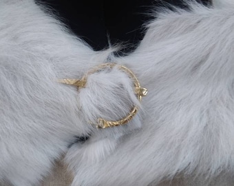 brass fibula, cape and moltière band