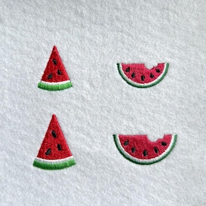 May include: Four embroidered watermelon slices on a white background. Two are triangular, and two are crescent-shaped, with red flesh, black seeds, a white rind, and green outer edge. The embroidery is detailed.