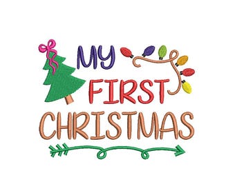 May include: Embroidered design with the text "MY FIRST CHRISTMAS" in colorful letters. A green Christmas tree with a pink bow is on the left. A string of Christmas lights and a green arrow complete the design, perfect for holiday crafts.