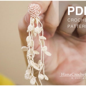May include: A PDF crochet pattern for a delicate white crocheted earring with a pink beaded top. The pattern is by Hana Crochet & design.