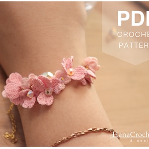 May include: A pink crocheted flower bracelet with clear beads. The bracelet is on a person's wrist. The image also includes the text "PDF CROCHET PATTERN".