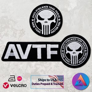 May include: Black and white embroidered patches featuring the text "AVTF" and a skull design. The patches also include the text "ANTI-VIGILANTE TASK FORCE NEW YORK MAYOR FISK". The patches are designed to be ironed on or attached with Velcro.