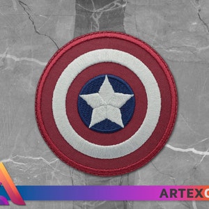 May include: A red, white, and blue embroidered patch with a white star in the center. The patch is circular and has a white border.