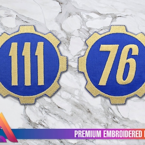 May include: Two embroidered patches with a blue background and gold stitching. The patches are shaped like a gear and feature the numbers 111 and 76.
