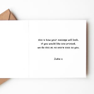 May include: A white card with black text that reads "this is how your message will look. if you would like one printed. we do this at no extra cost to you. Judie x"