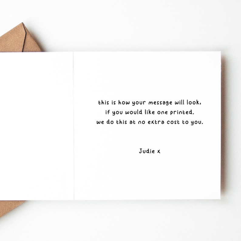May include: A white card with black text that reads "this is how your message will look. if you would like one printed. we do this at no extra cost to you. Judie x"