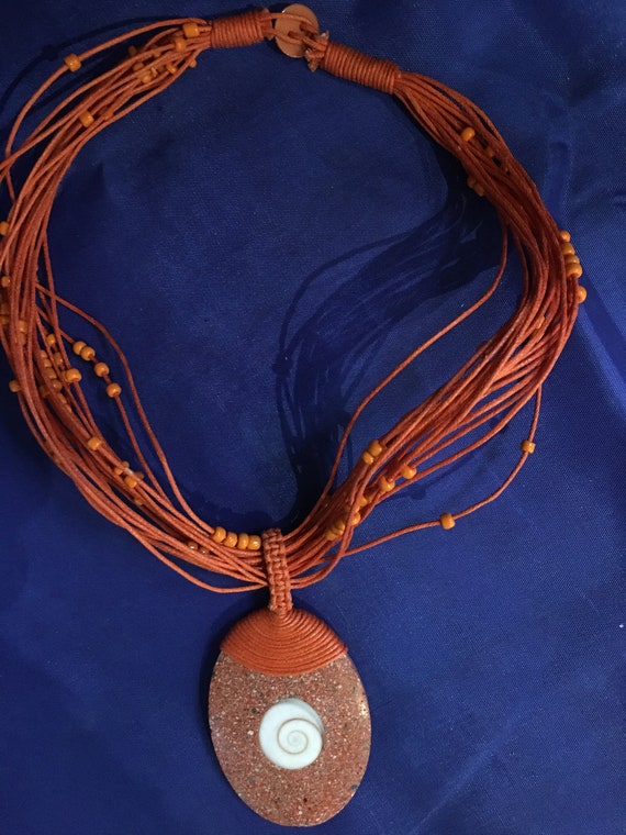 Vintage Indonesian orange stone with inset shell n