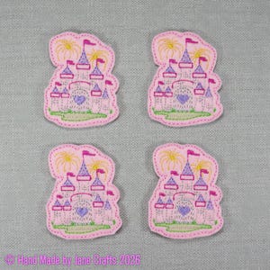 May include: Four pink embroidered castle patches with purple turrets, yellow fireworks, and a heart design. Each patch has a green stitched base and a pink border. The text "Hand Made by Jane Crafts 2026" is at the bottom.