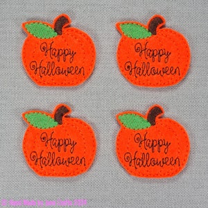 May include: Four orange felt pumpkins with green stems and leaves. Each pumpkin has the text "Happy Halloween" embroidered in black.