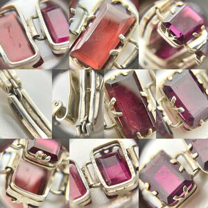 May include: A silver bracelet with a series of linked rectangular frames, each containing a deep red gemstone. The bracelet is made of polished silver and has a secure clasp.