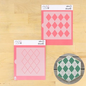 May include: Two pink plastic stencils for decorating cookies with a diamond pattern. The stencils are shown next to a decorated cookie with a green and white diamond pattern.