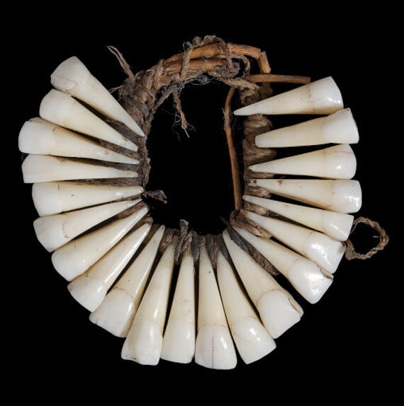 Necklace made of real human teeth,coconut sennit