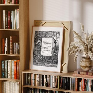 May include: A black and white print of a poem titled "Hope" framed in a light wood frame. The poem is set against a backdrop of a forest scene with trees and flowers.