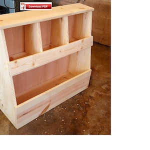 May include: A wooden shelf unit with multiple cubbyholes and a large open storage space at the bottom. The shelf is made of unfinished pine wood.