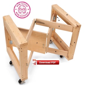 May include: A wooden folding table with wheels and labelled parts A to F. The table is made of unfinished wood and has a simple design. The table is folded up and ready to be moved.