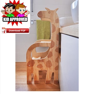 May include: A wooden giraffe-shaped step stool for children. The stool has a brown and tan giraffe print and is made of plywood. The stool is in a bathroom setting.