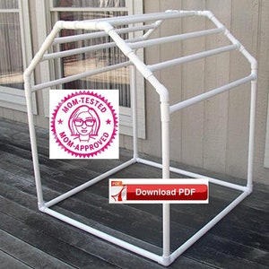 May include: White PVC pipe frame structure with a rectangular base and a sloped roof. The frame is designed for hanging items, possibly for drying clothes or storing items.