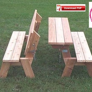 May include: A wooden picnic table with two benches that fold up against the table. The table is made of natural wood and has a simple design. The benches are also made of natural wood and have a simple design.
